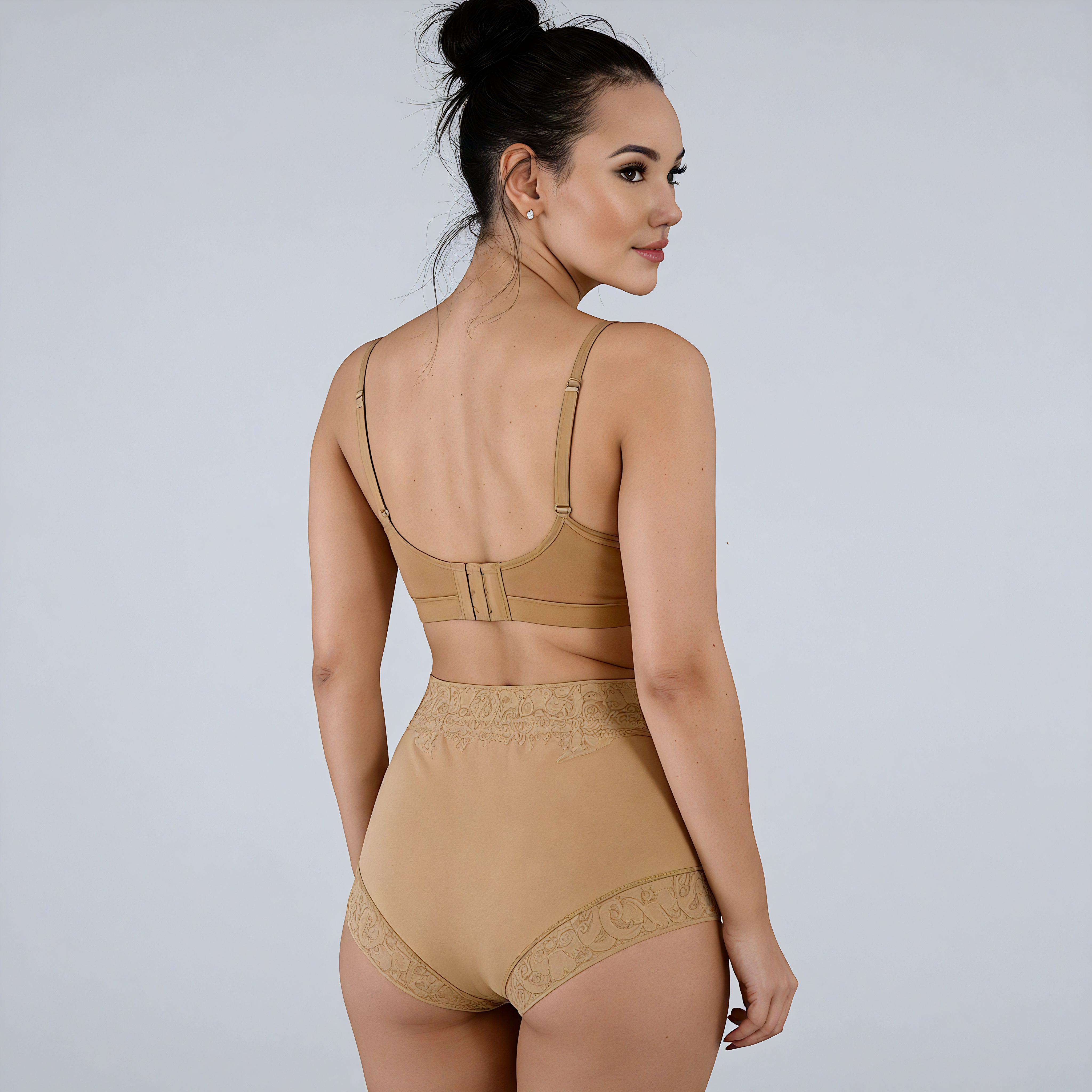 Woman wearing a beige bodysuit against a plain background shapewear 